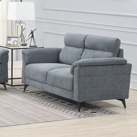 Grey fabric sofa with padded backrest and armrests in a modern living room setting