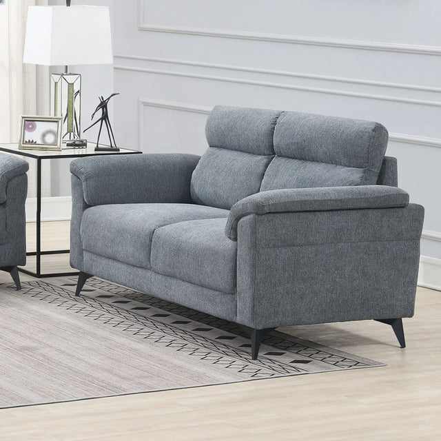 Grey fabric sofa with padded backrest and armrests in a modern living room setting