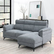 Grey fabric sectional sofa with chaise on right side in modern living room setting