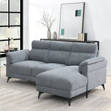 Grey fabric sectional sofa with chaise on right side in modern living room setting