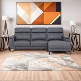 Grey sectional sofa with right-hand chaise on geometric rug, modern living room decor