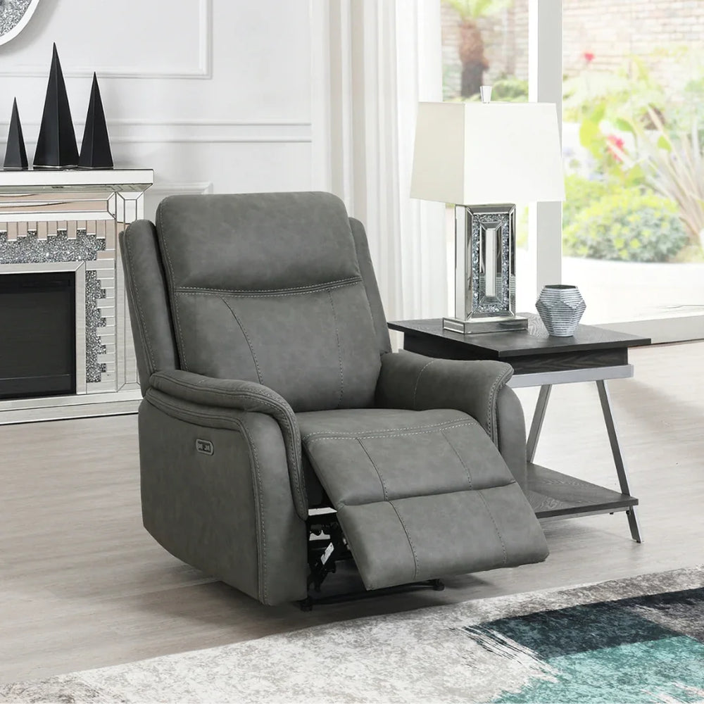 Stone grey armchair recliner with padded arms in modern living room beside side table