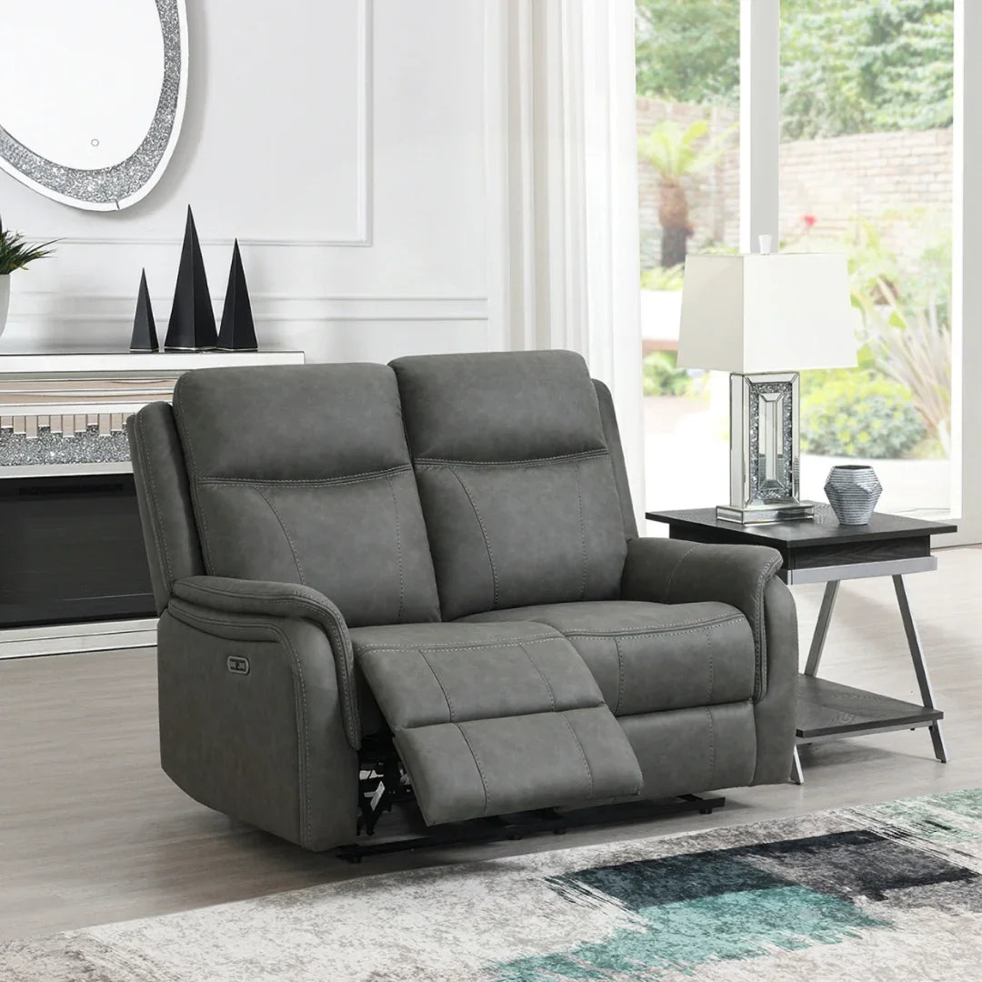Stone grey loveseat sofa with recliner feature in bright living room setting
