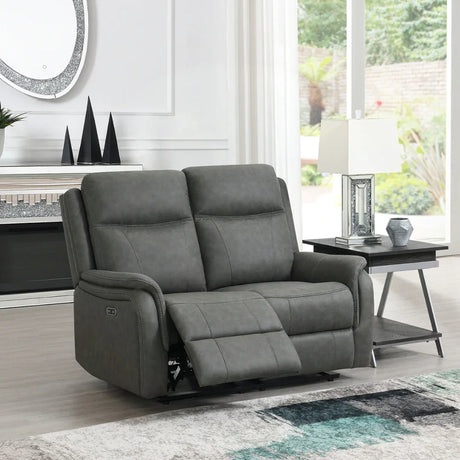 Stone grey loveseat sofa with recliner feature in bright living room setting