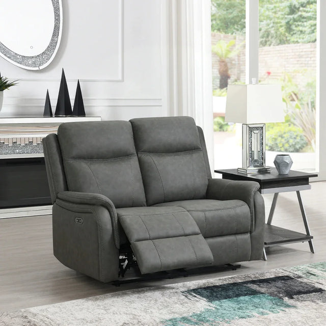Stone grey loveseat sofa with recliner feature in bright living room setting