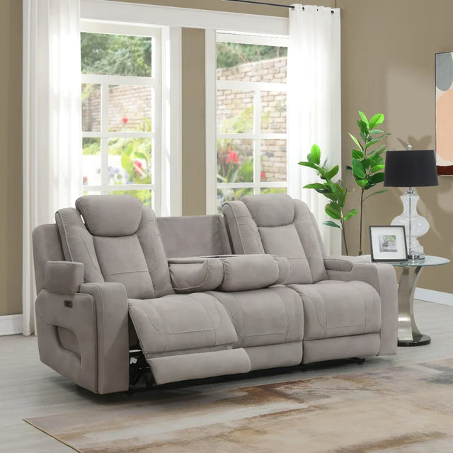 Light grey reclining sofa with padded armrests and cup holders in a modern living room