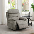 Cream armchair with matching piping and reclining footrest beside window and round side table