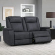 Graphite fabric loveseat sofa with dual recliner seats in modern living room setting