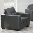 Dark grey leather armchair with square arms and tufted seat in modern living room