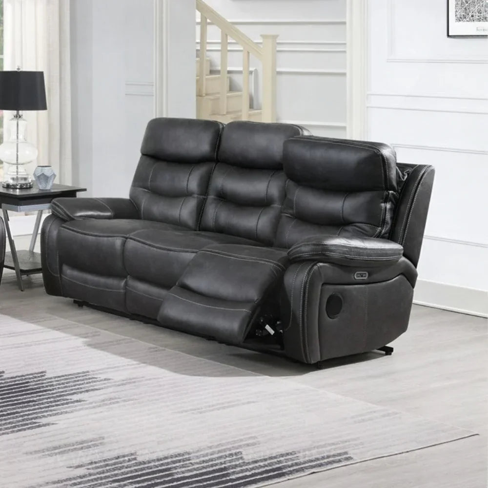 Slate grey recliner sofa with padded seats and matching piping in modern living room