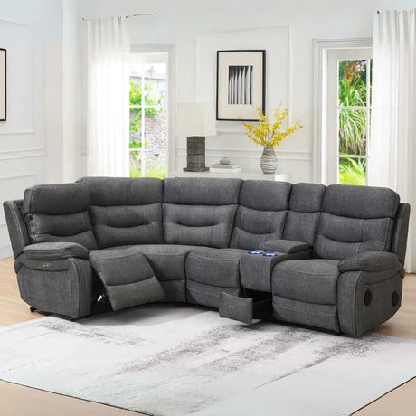 Dark grey tech reclining corner sofa with cup holders and console in modern living room