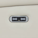 Closeup of sofa USB charging port on light grey leather upholstery