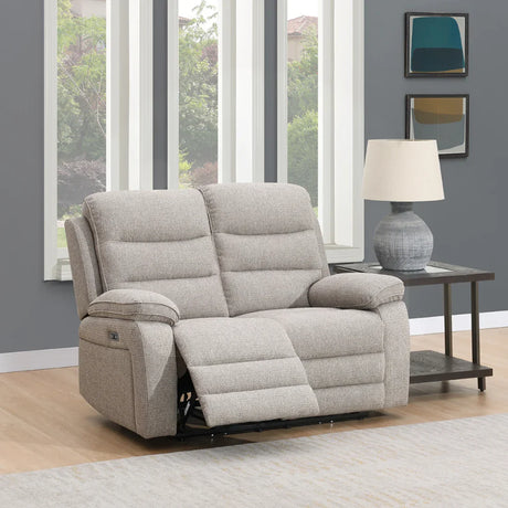 Beige fabric 2 seater reclining sofa with padded arms in living room beside lamp table