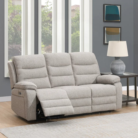 Beige 3 seater sofa with recliner feature in modern living room next to side table and lamp