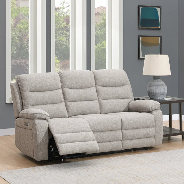 Beige 3 seater sofa with recliner feature in modern living room next to side table and lamp