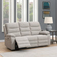 Beige 3 seater sofa with recliner feature in modern living room next to side table and lamp