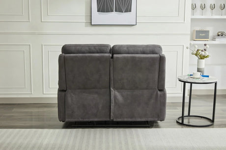 Back view of grey two seater fabric sofa beside round marble side table in modern room