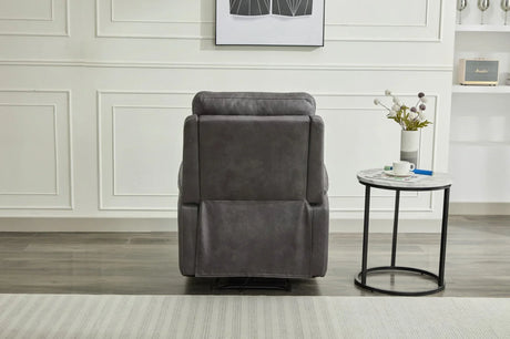 Grey recliner armchair rear view beside round marble side table in modern living room