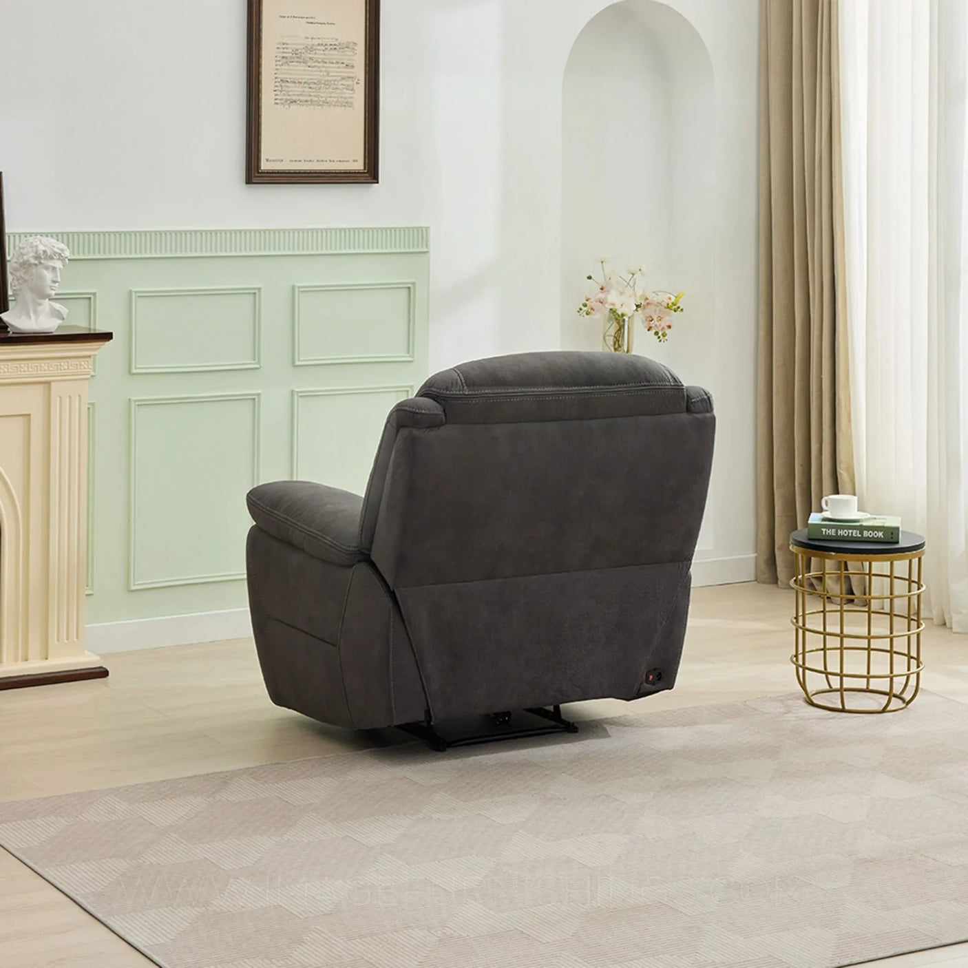 Gunmetal armchair with reclining feature in modern living room setting