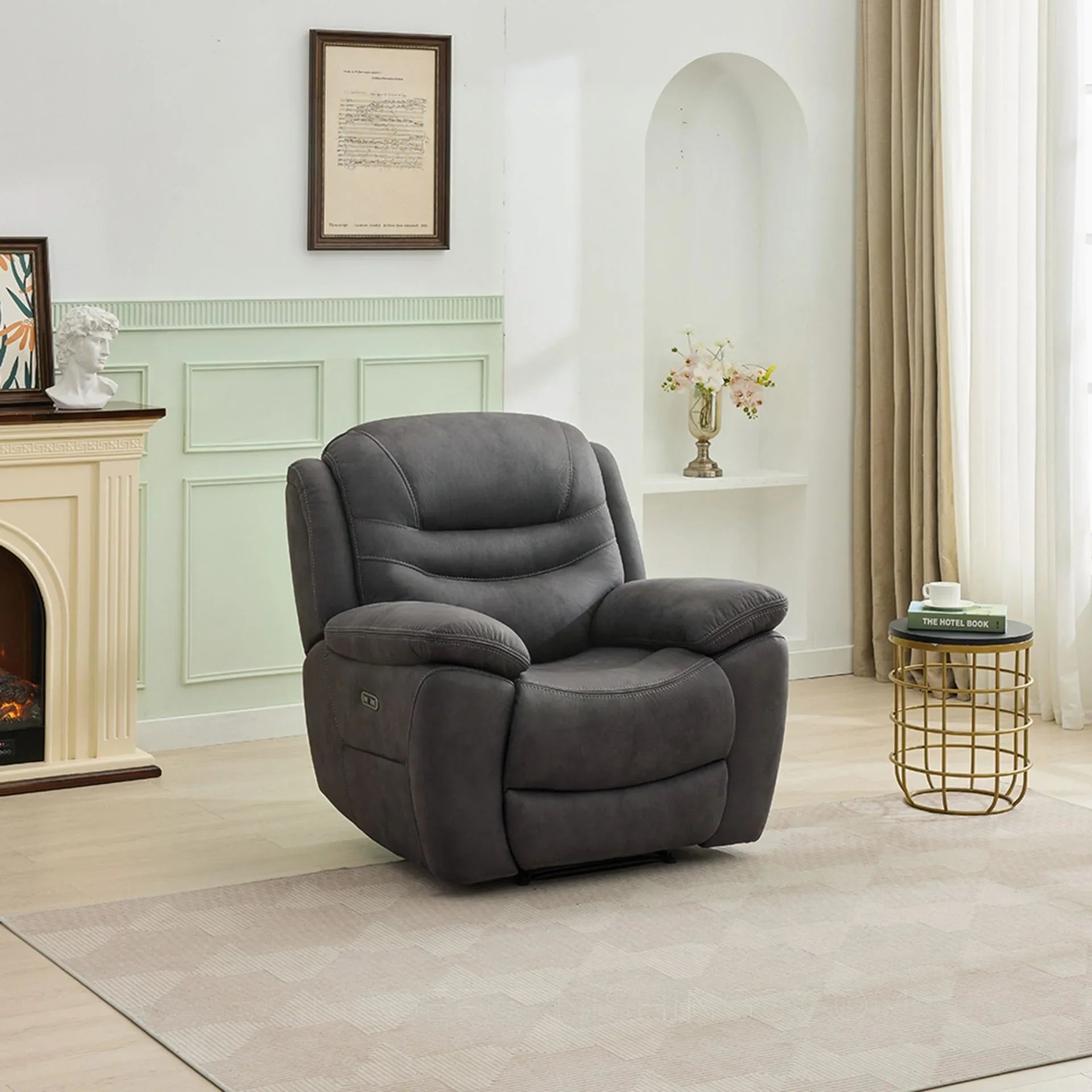 Gunmetal one-seater armchair with plush cushions in modern living room setting