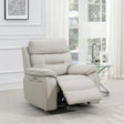 Light grey leather recliner armchair with footrest in modern living room setting