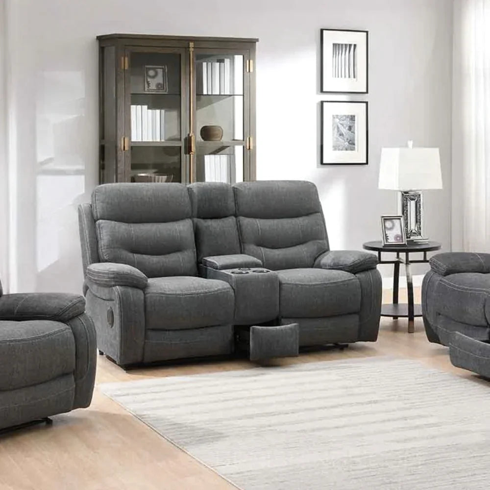 Dark grey reclining fabric sofa with cup holders and matching piping in modern living room