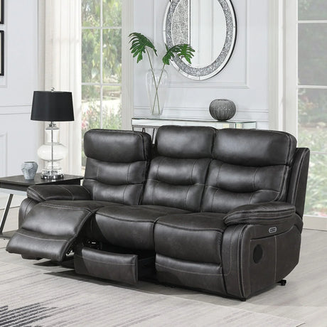 Grey three seater recliner sofa with footrest extended in bright living room setting