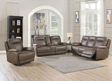 Brown leather recliner chair with padded armrests and stitching in modern living room