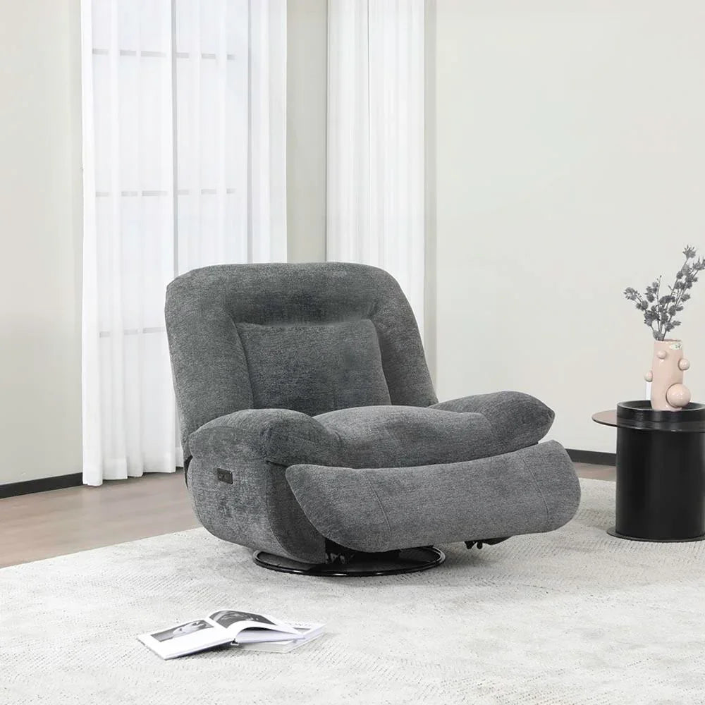 Dark grey reclining chair with plush upholstery in a modern living room setting