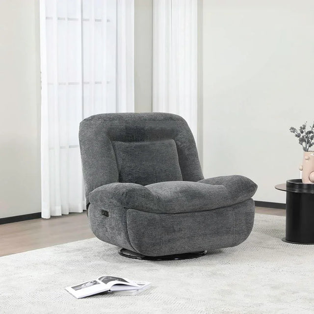 Dark grey reclining chair upholstered in fabric, placed on light rug near side table