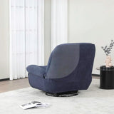 Indigo reclining chair on a light rug beside a round black side table with vase