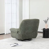 Green reclining chair on light rug beside round black table and vase in modern living room