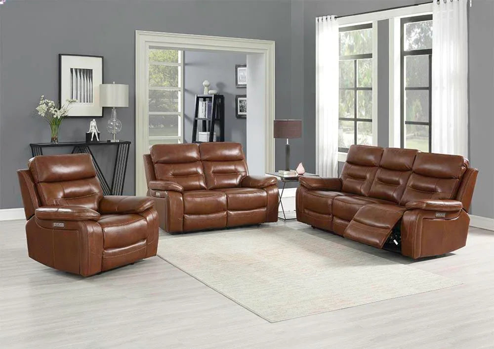 Brown leather sofa set with recliners in modern living room with grey walls and large windows