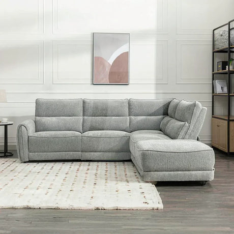 Light grey fabric sectional sofa with chaise on right in modern living room setting