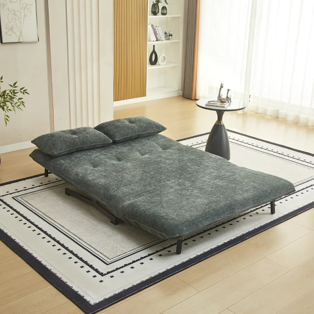 Tucker double sofa bed in winter moss fabric set up as a bed on a patterned rug