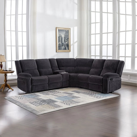 Charcoal fabric corner sofa with recliners in bright living room on patterned area rug