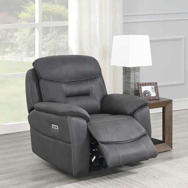 Charcoal grey leather recliner armchair with footrest in modern living room setting