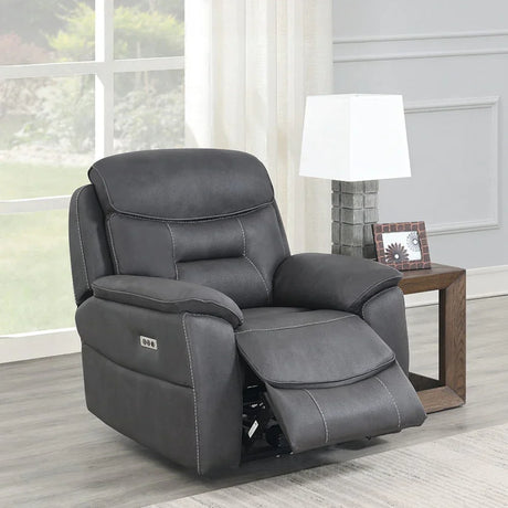 Charcoal grey leather recliner armchair with footrest in modern living room setting