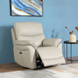 Light grey leather recliner chair with footrest extended beside a black round side table