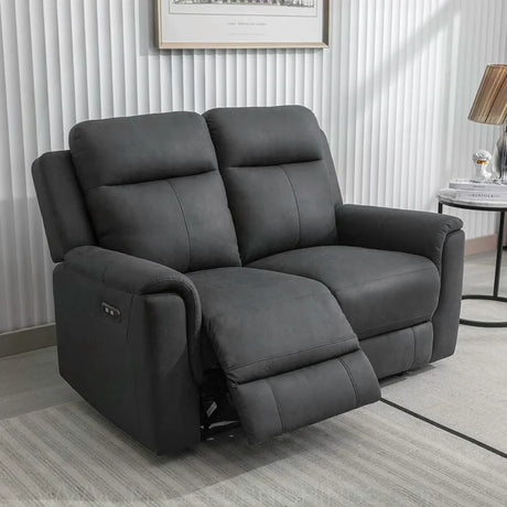Gunmetal grey two seater recliner sofa with manual footrest in modern living room
