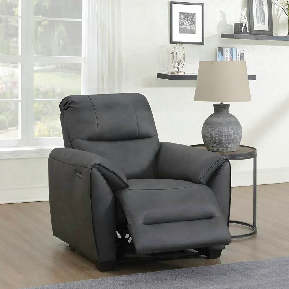 Dark grey recliner armchair with footrest in modern living room setting