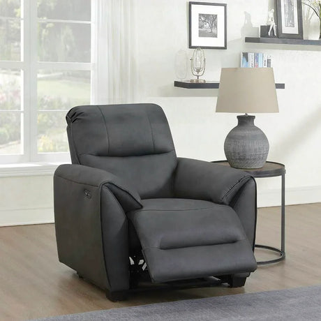 Dark grey recliner armchair with footrest in modern living room setting