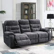 dark grey three seater reclining sofa with plush upholstery in modern living room