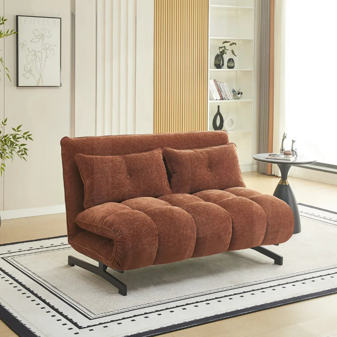 Double sofa bed in deep terra fabric with metal legs in modern living room setting