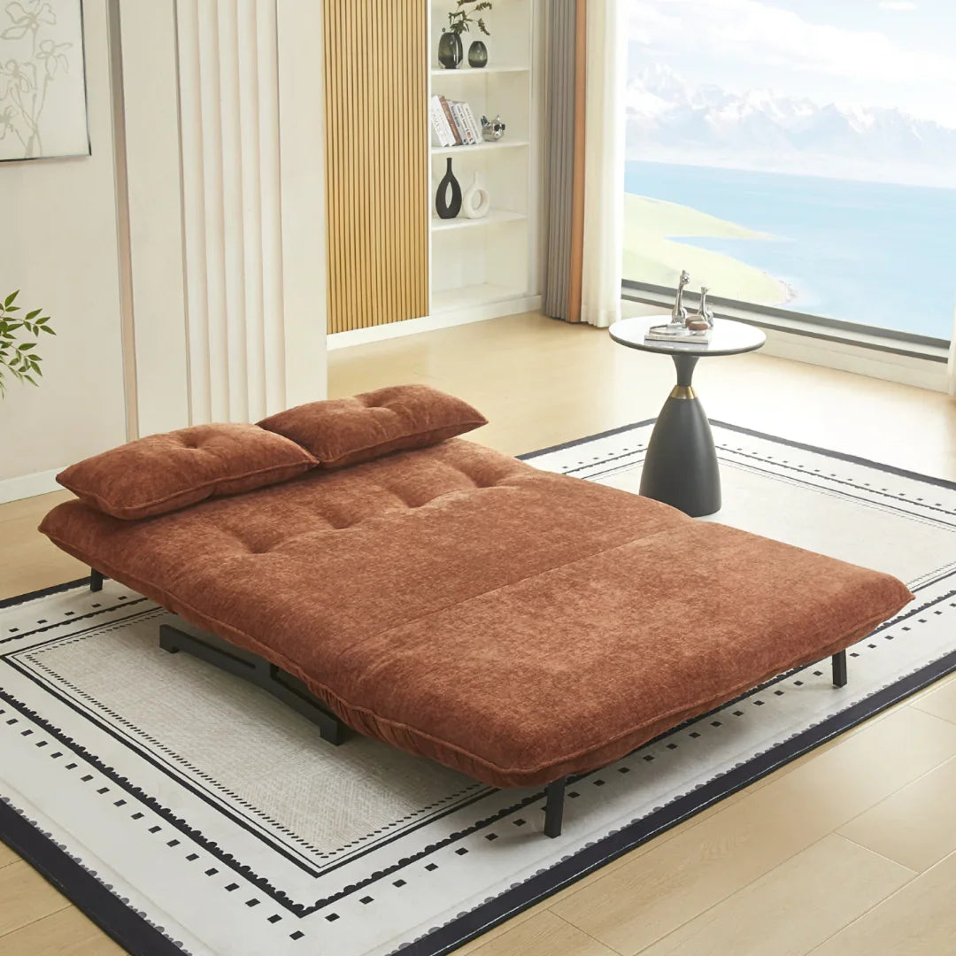 Tucker double sofa bed in deep terra fabric unfolded as bed on patterned rug in modern living room