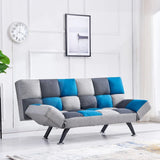 Teal and grey patchwork sofa bed with angled metal legs in bright living room
