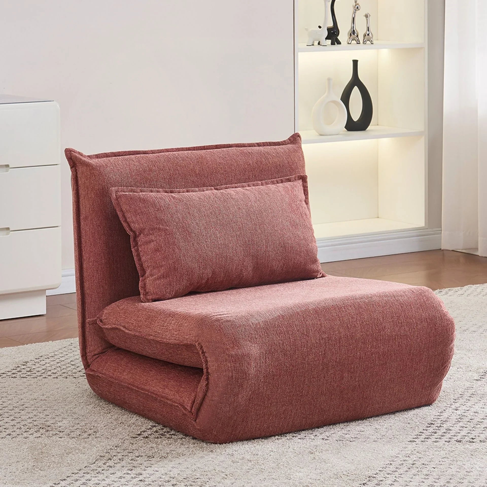 Rust fabric sofa bed with cushion in modern living room on beige rug