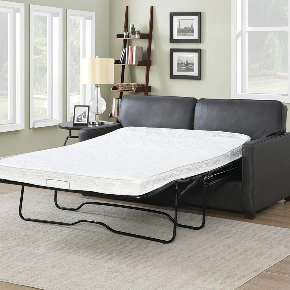 Grey sofa bed with mattress extended in modern living room setting