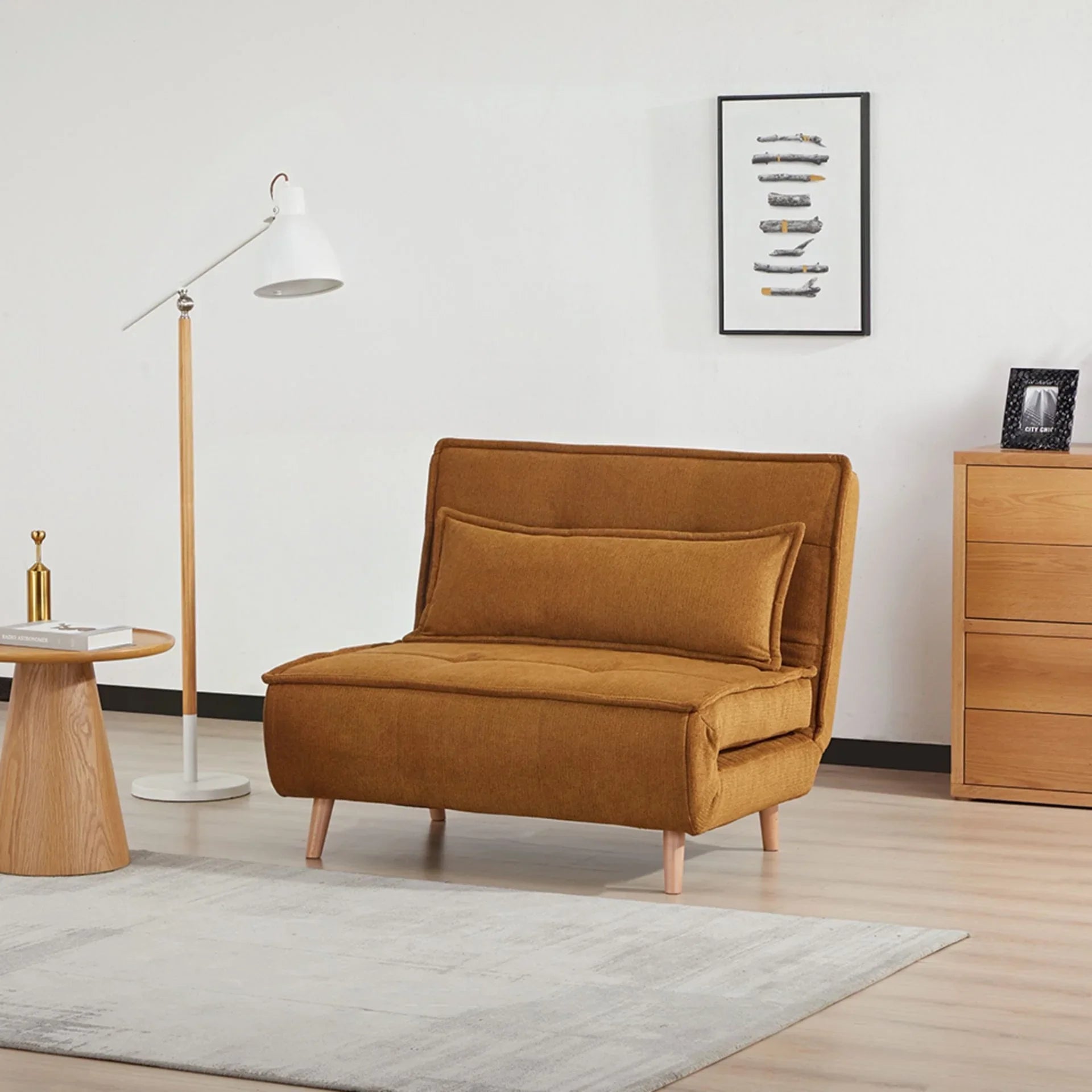 Pumpkin fabric sofa bed with cushion, wooden legs, in modern living room setting