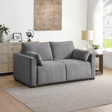 Light grey foam sofa bed with cushions in modern living room setting